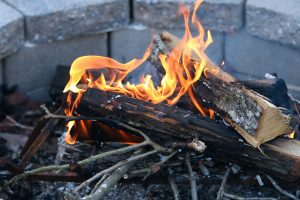 a fire pit with burning wood