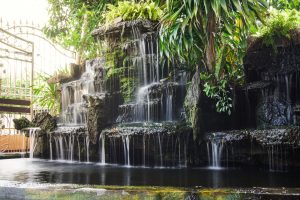 backyard waterfalls installed by a pool