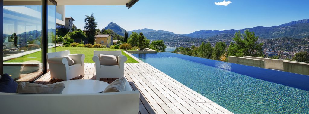 a beautiful swimming pool in a homes backyard