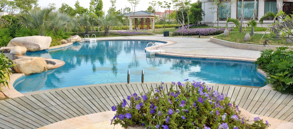 a beautiful swimming pool in a home's backyard