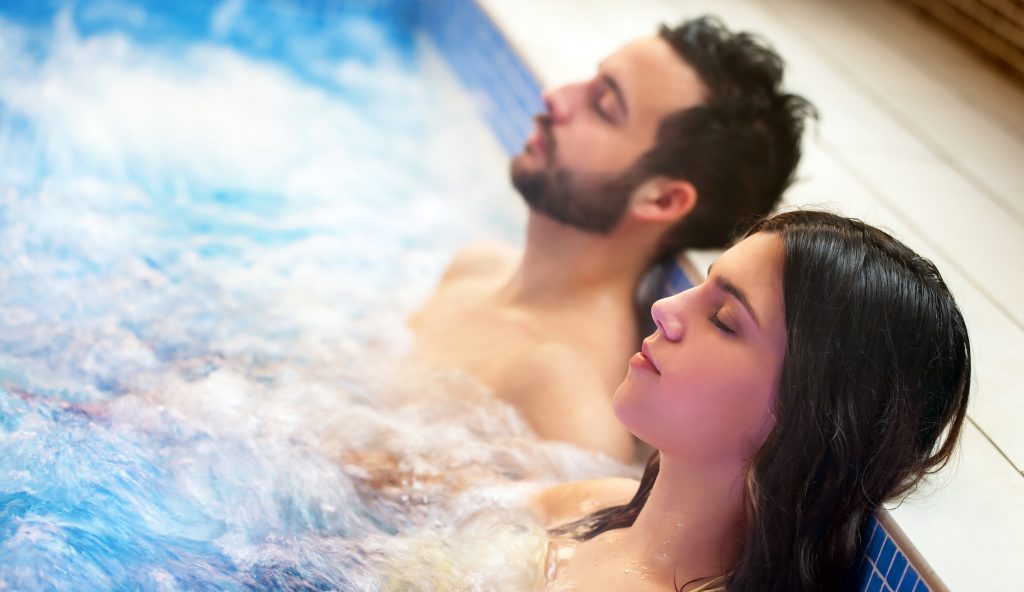 a young couple relaxing in a Hot Tubs