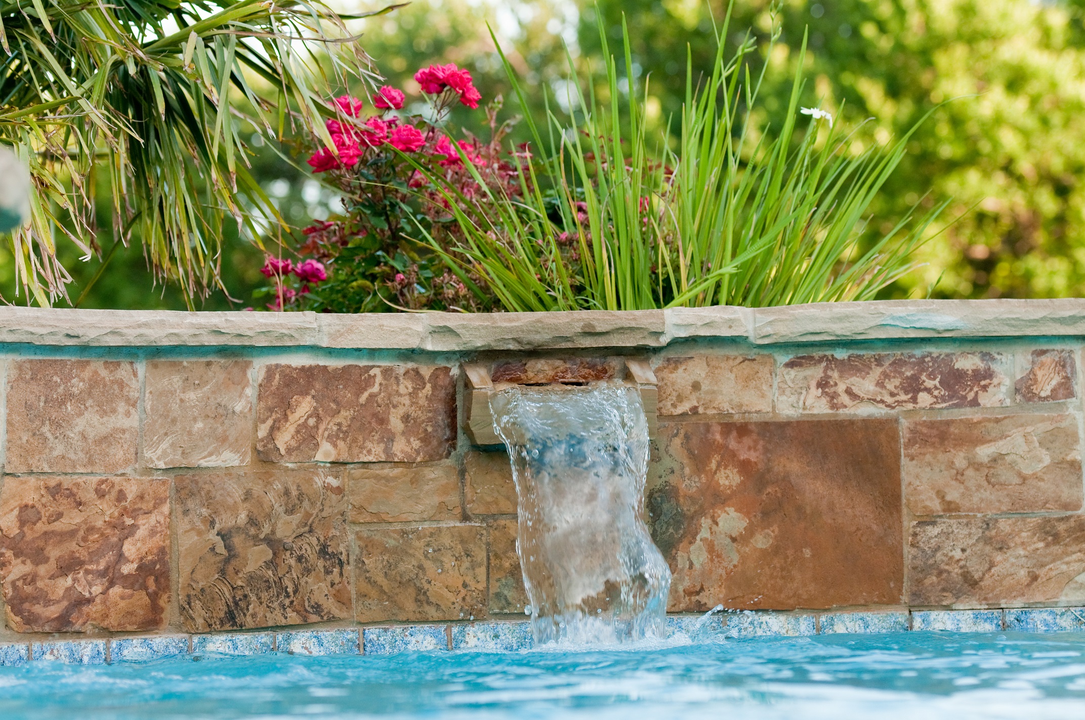 small waterfall in a pool